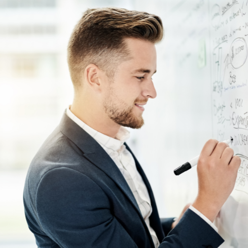 Man writing on whiteboard